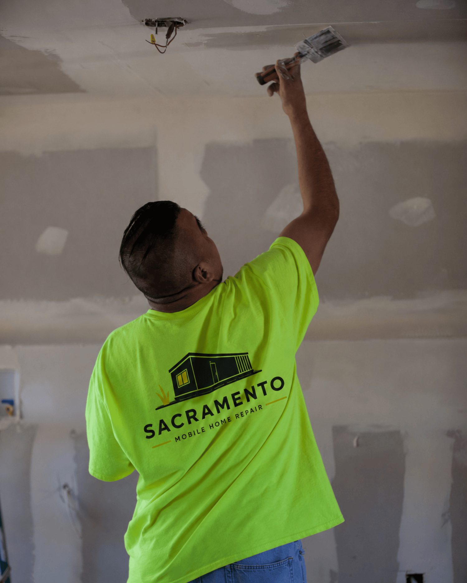 Sacramento Mobile Home Repair technician patching an interior ceiling